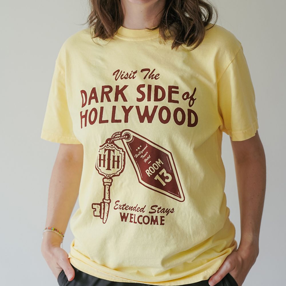 Front view of Disney-inspired Dark Side of Hollywood t-shirt featuring the phrase ‘Visit The Dark Side of Hollywood,’ an image of a hotel key labeled Room 13, and the text ‘Extended Stays Welcome.'