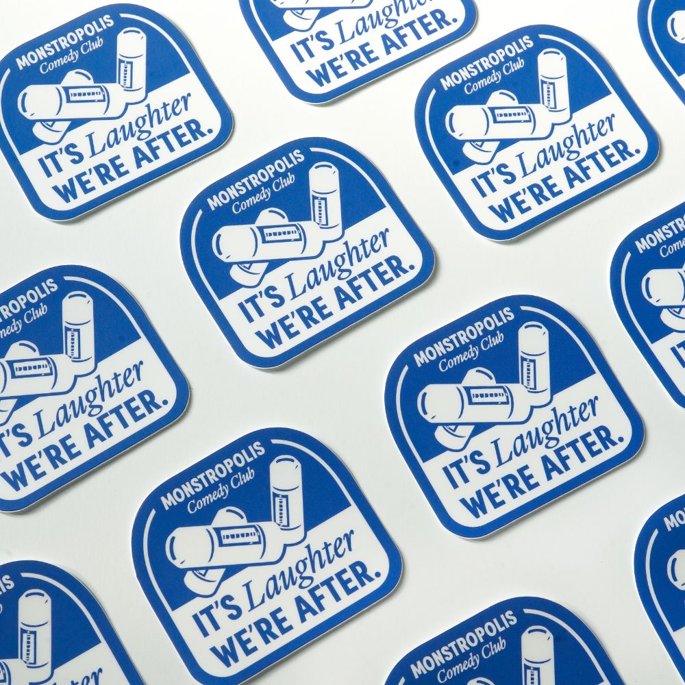 Monstropolis Comedy Club Disney-inspired sticker with phrase ‘It’s Laughter We’re After’ and three laugh canisters.