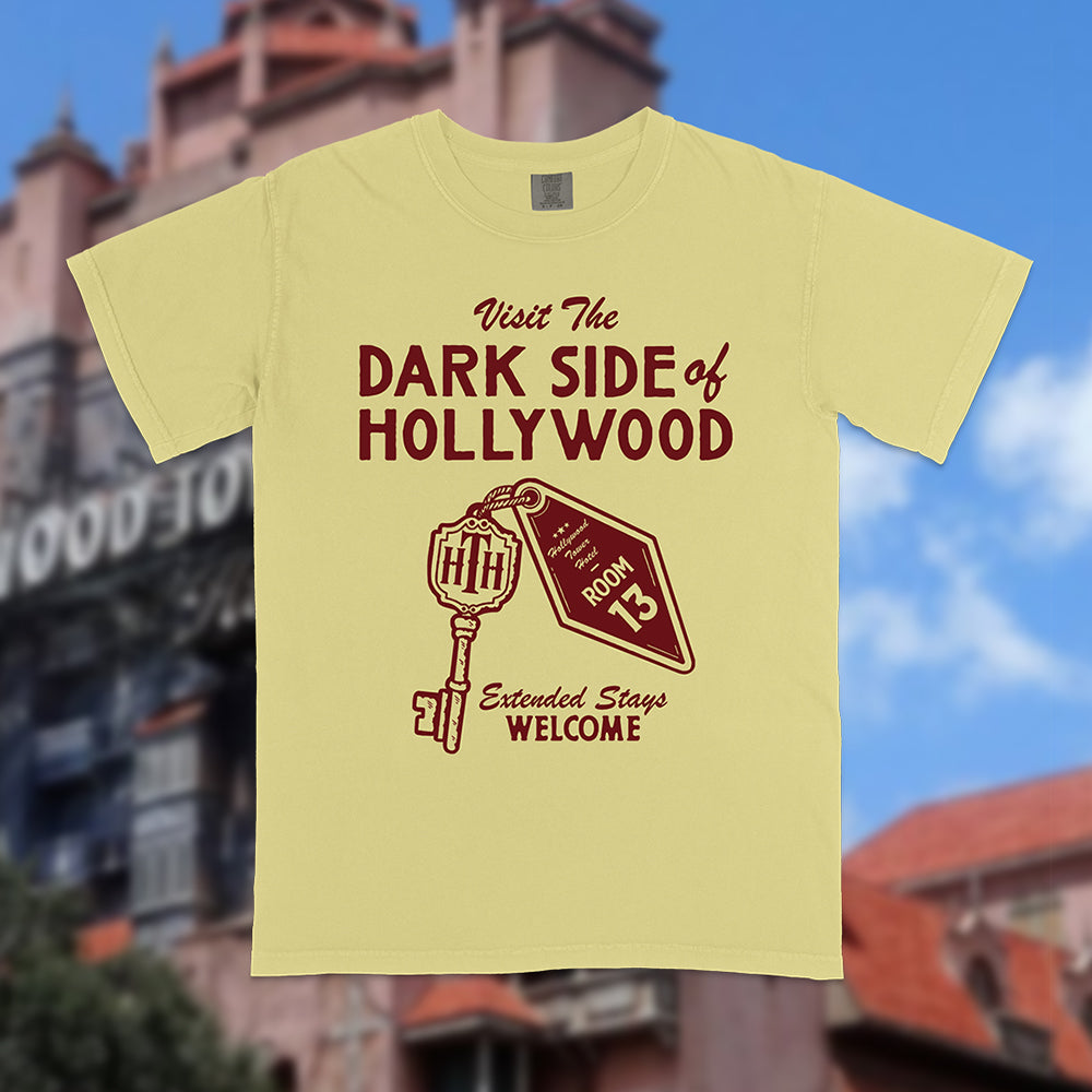 Front view of Disney-inspired Dark Side of Hollywood t-shirt featuring the phrase ‘Visit The Dark Side of Hollywood,’ an image of a hotel key labeled Room 13, and the text ‘Extended Stays Welcome.'