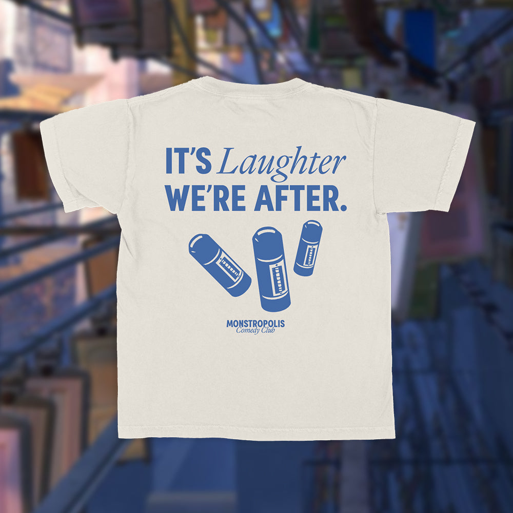 Back view of Disney-inspired Monstropolis Comedy Club crop top with the phrase ‘It’s Laughter We’re After’ above three laugh canisters and Monstropolis Comedy Club text underneath.