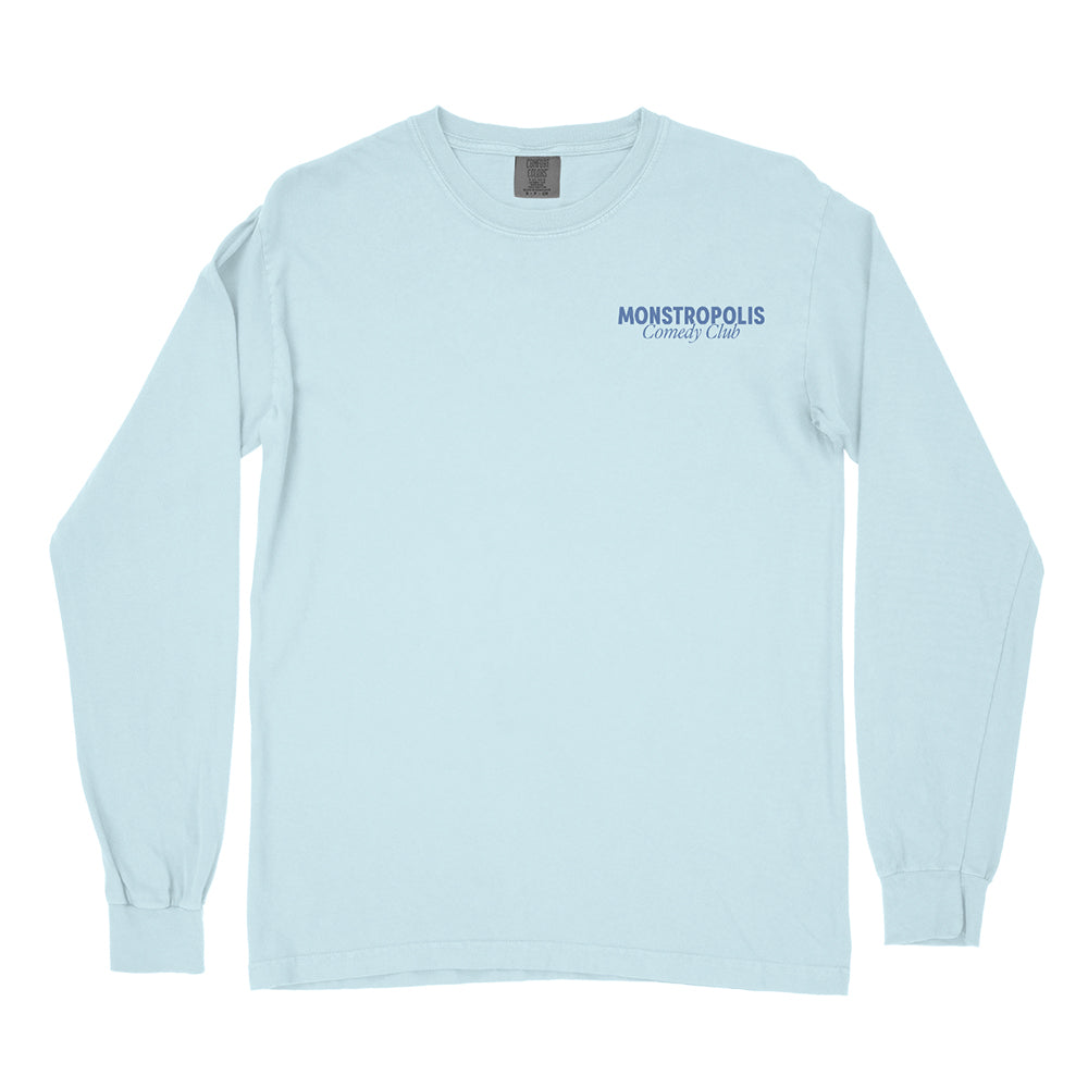 Front view of Disney-inspired Monstropolis Comedy Club long sleeve t-shirt with small left chest logo text reading Monstropolis Comedy Club.