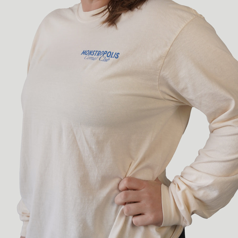 Front view of Disney-inspired Monstropolis Comedy Club long sleeve t-shirt with small left chest logo text reading Monstropolis Comedy Club.