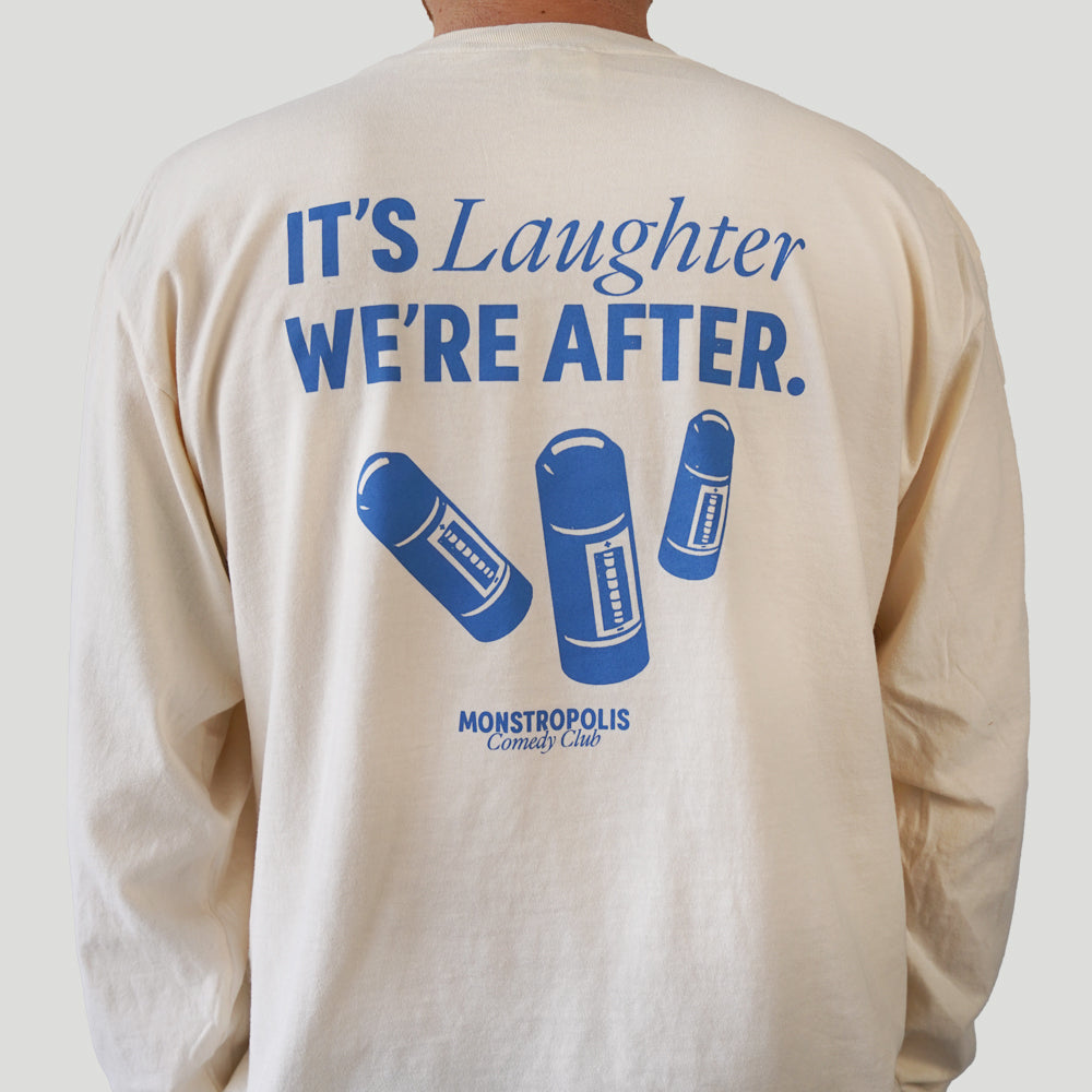 Back view of Disney-inspired Monstropolis Comedy Club long sleeve t-shirt featuring the phrase ‘It’s Laughter We’re After’ above three laugh canisters with Monstropolis Comedy Club text underneath.