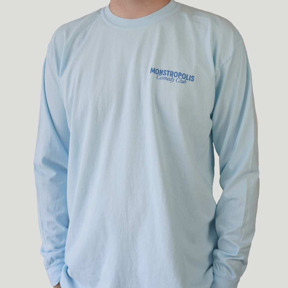 Front view of Disney-inspired Monstropolis Comedy Club long sleeve t-shirt with small left chest logo text reading Monstropolis Comedy Club.